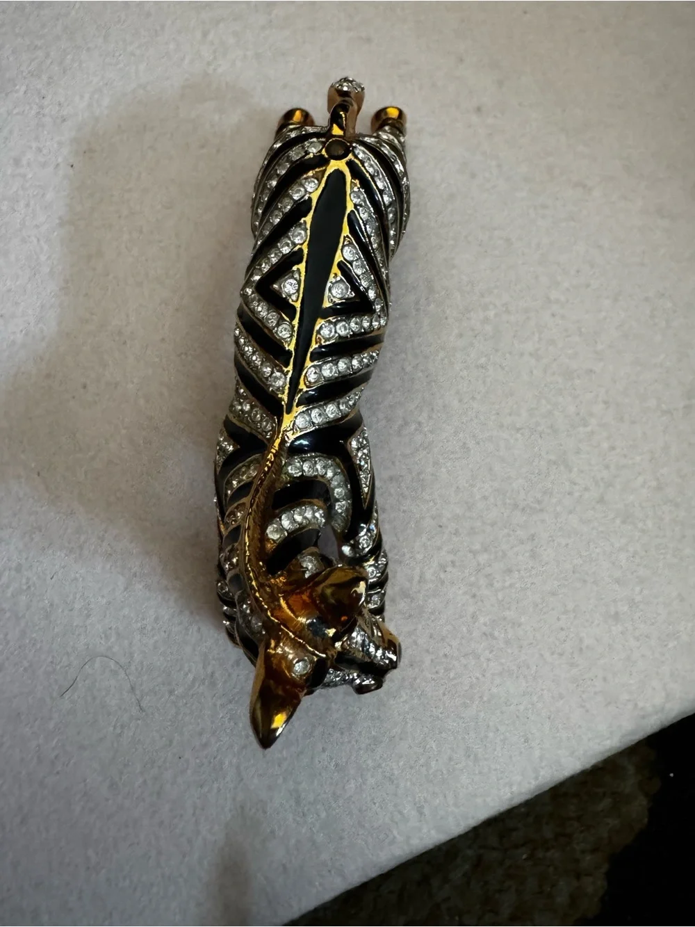 Vintage 1980s gold and black enamel over the shoulder brooch
